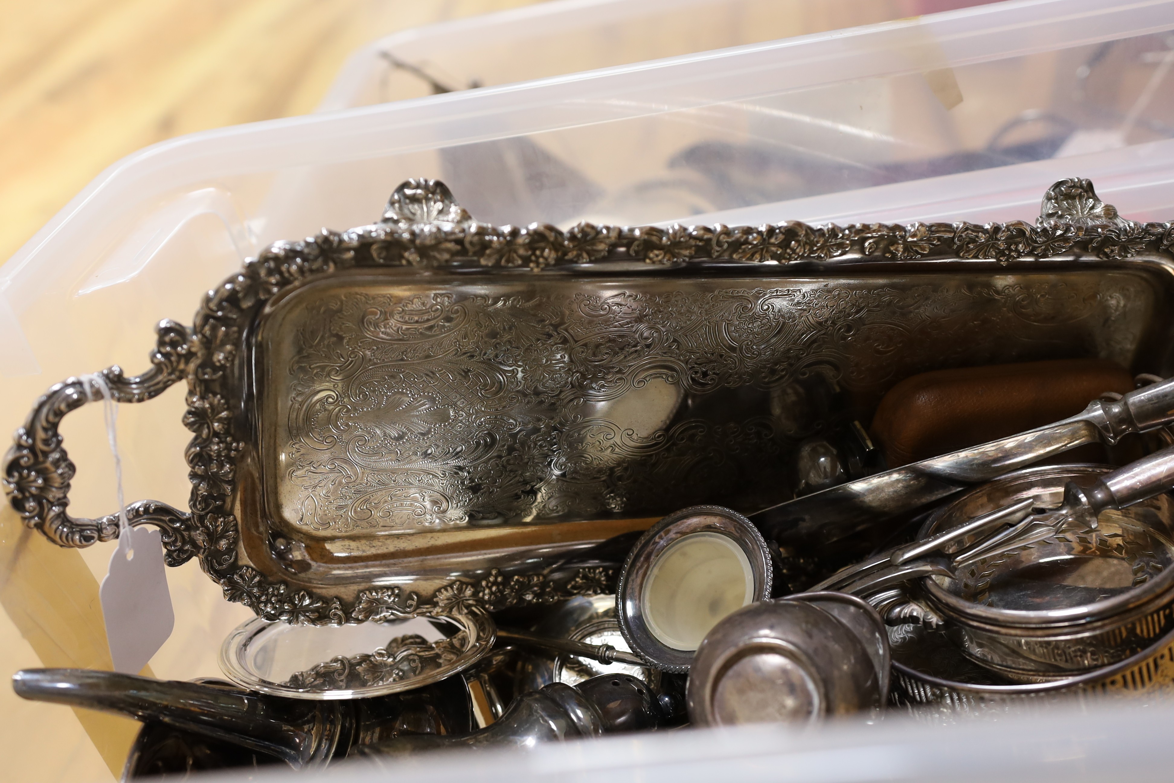 A large quantity of assorted plate wares including an Elkington & Co bottle pourer, a model yacht, two hip flasks, flatware, chambersticks, etc.